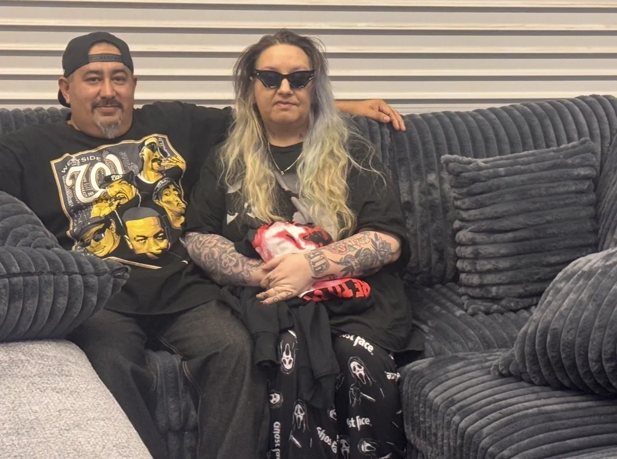 Happy customers on a gray sectional at our Elk Grove showroom